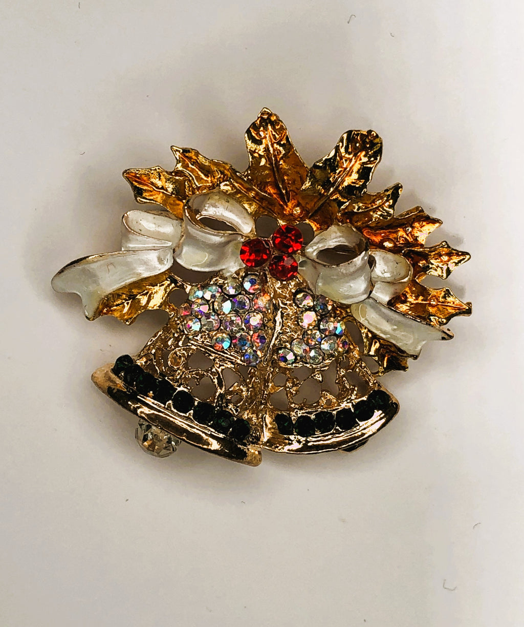 Rose gold bells with white bow and golden holly brooch at erika