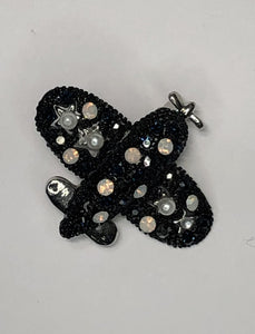 Black and silver biplane with pearl and diamantes brooch at erika