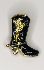 Black cowboy boot with gold rearing horse emblem brooch at erika