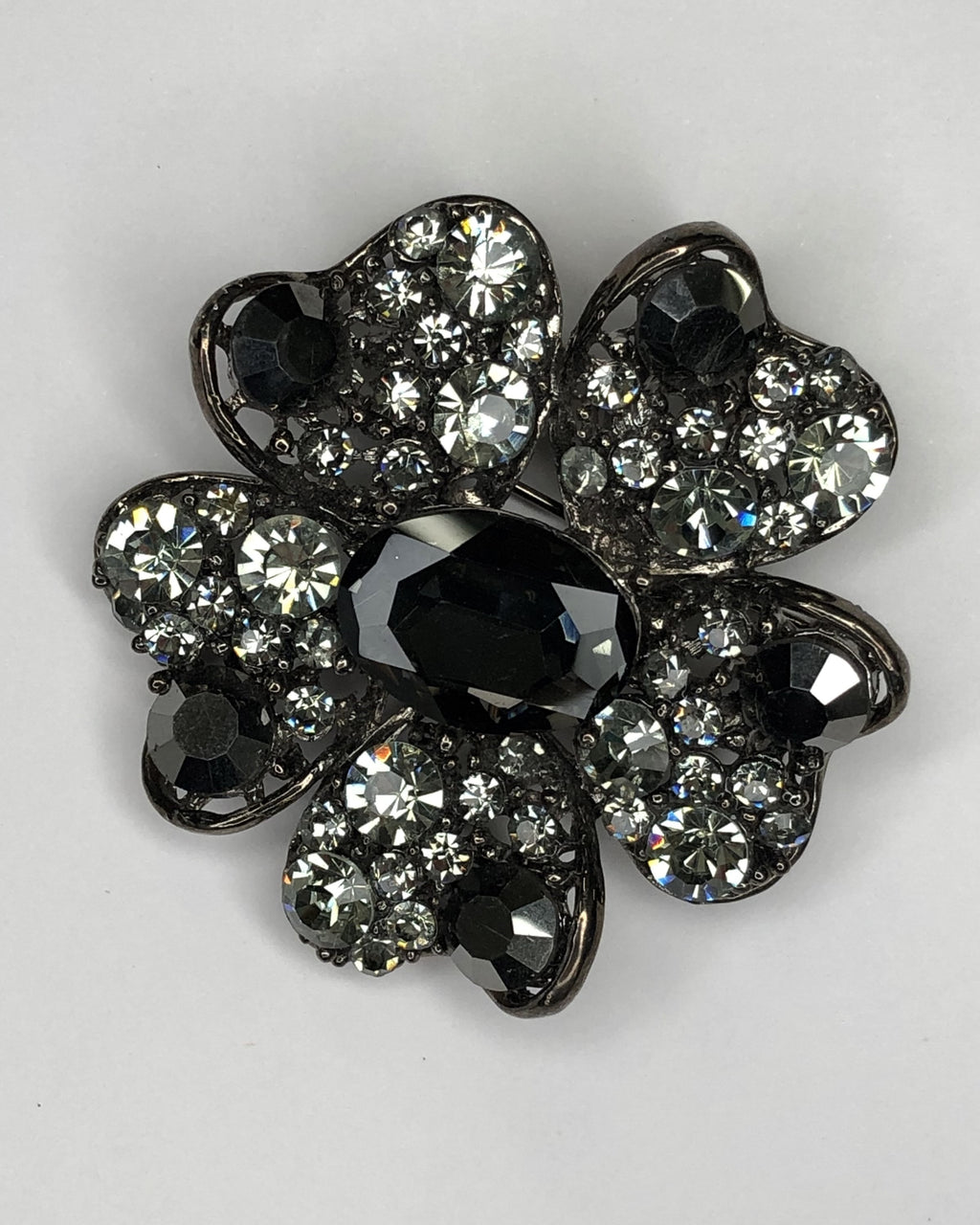 Black & grey crystal flower with black central stone brooch at erika