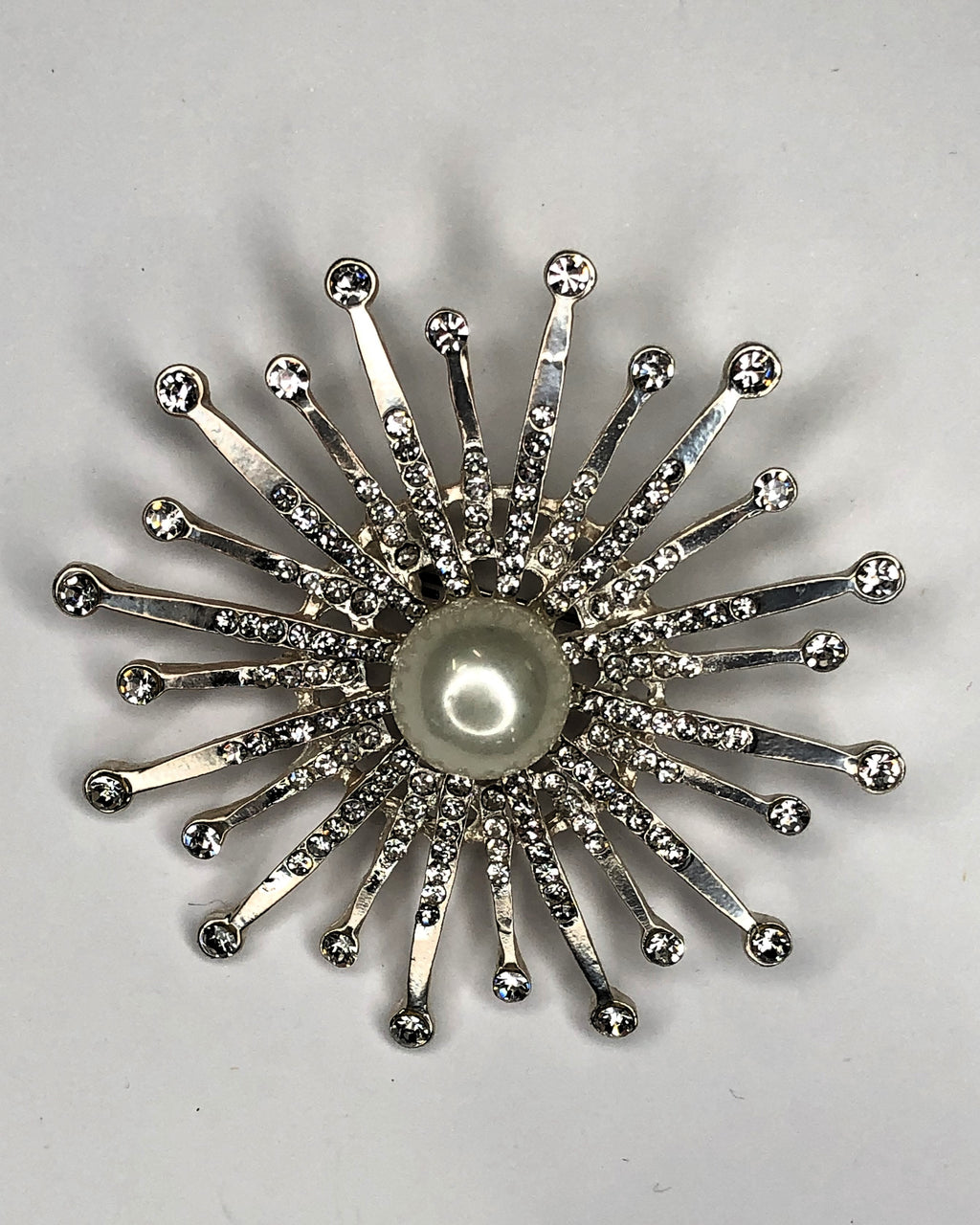 Silver star burst pearl & diamante brooch at erika