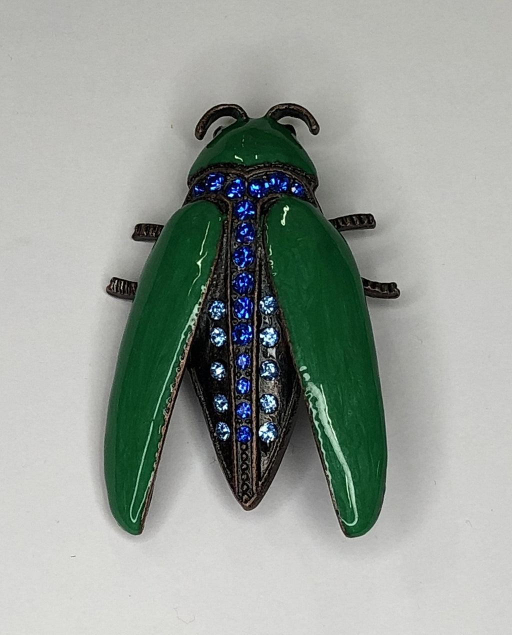 Large cicada beetle with green enamel wings and blue diamante body brooch at erika