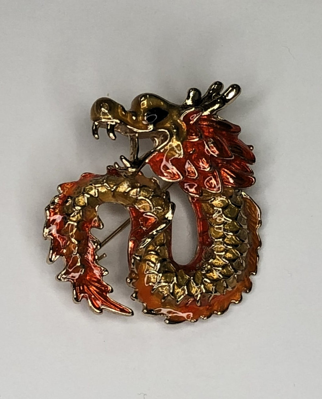 Orange and gold enameled dragon brooch at erika