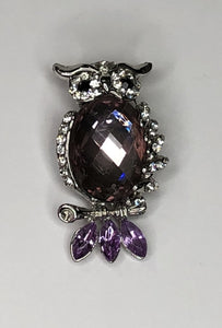 Silver owl with faceted body and purple tail feathers brooch at erika