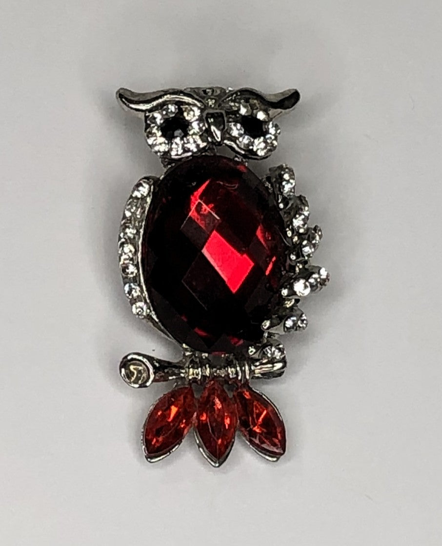 Silver owl with faceted body and red tail feathers brooch at erika