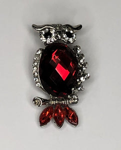 Silver owl with faceted body and red tail feathers brooch at erika