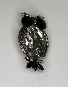 Silver owl with large faceted clear body and black eyes and tail feathers brooch at erika