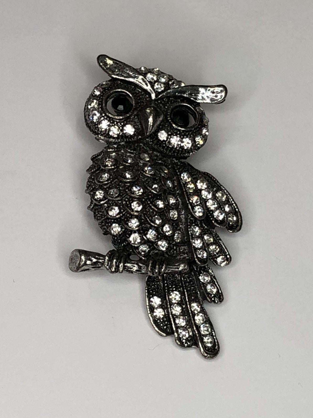 Large silver diamante owl sitting on branch brooch at erika