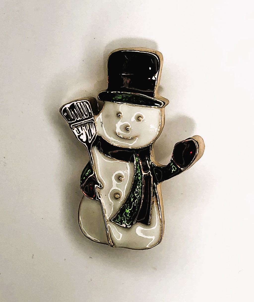 Snowman with top hat holding broom brooch at erika