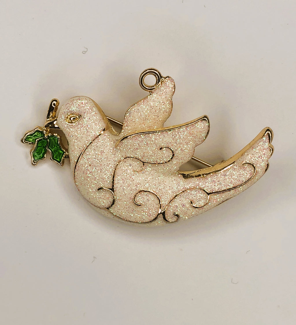 White peace dove in flight holding olive leaf brooch at erika