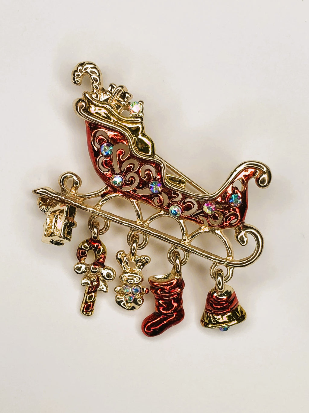 Red and gold sleigh with Christmas gifts brooch at erika