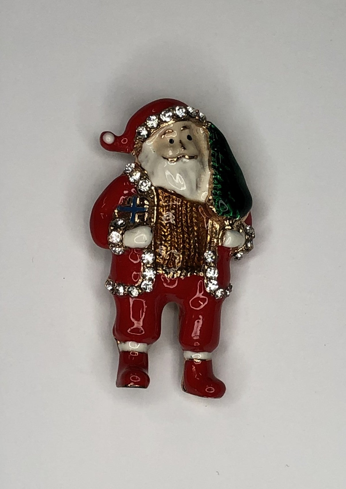 Santa carrying Christmas tree brooch at erika