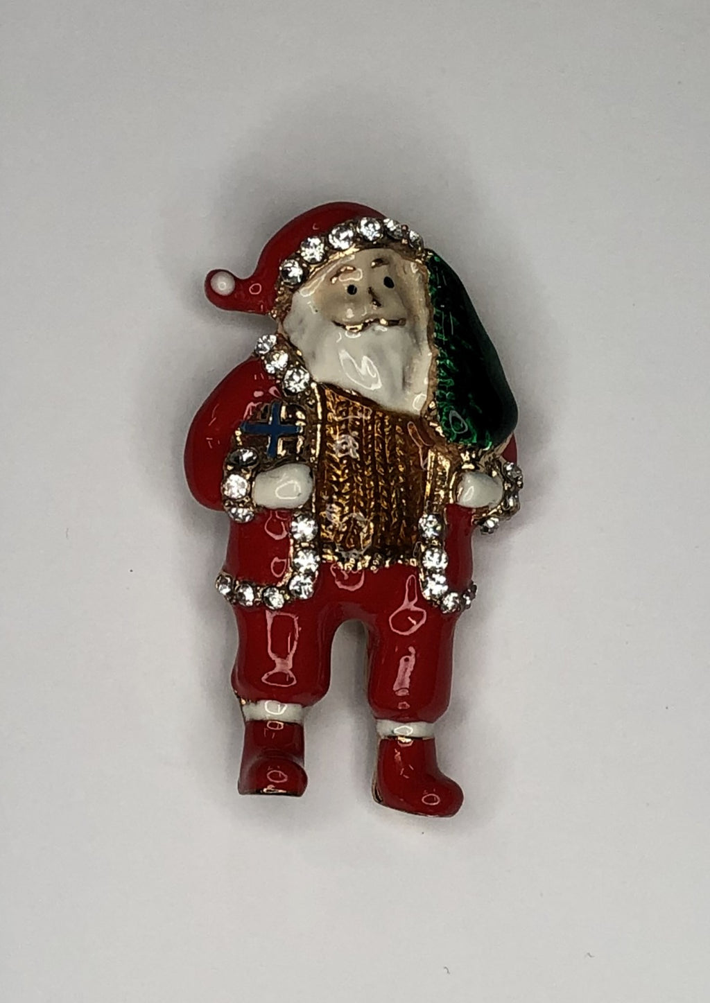 Santa carrying Christmas tree brooch at erika