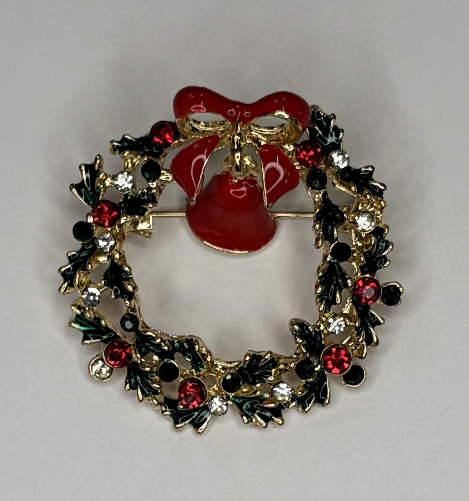 Christmas wreath with red bell brooch at erika