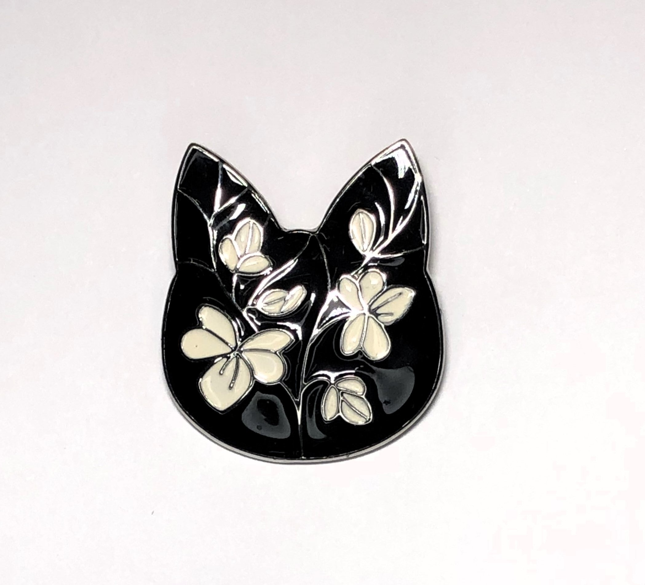 Black and white enameled cat face brooch at erika