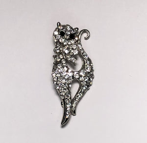 Silver cat with bow neck tie brooch at erika