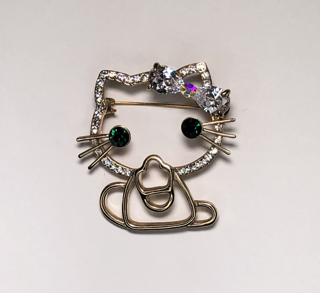 Gold diamante Hello Kitty emerald eyes cat brooch at erika