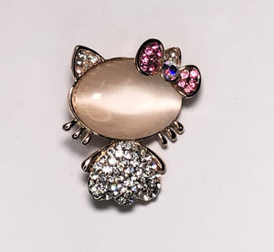 Gold diamante cat with pink bow brooch at erika