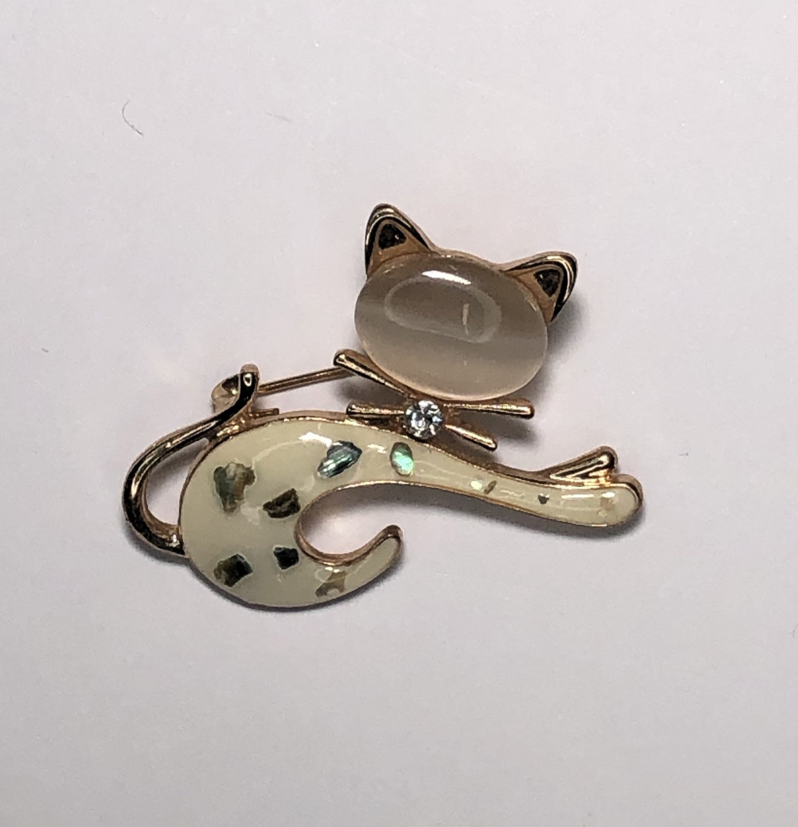 Enameled cream with Mother of Pearl inlay cat brooch at erika