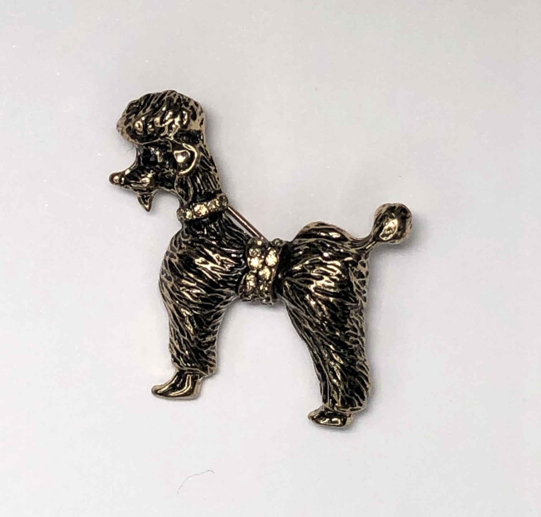 Gold poodle dog with cognac coloured diamante collar brooch at erika