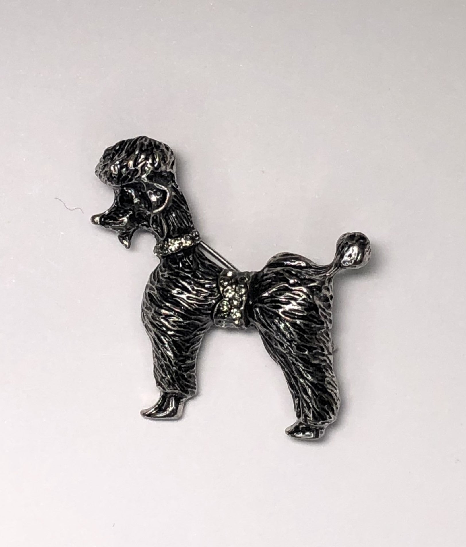 Silver and black poodle dog with clear diamante collar brooch at erika