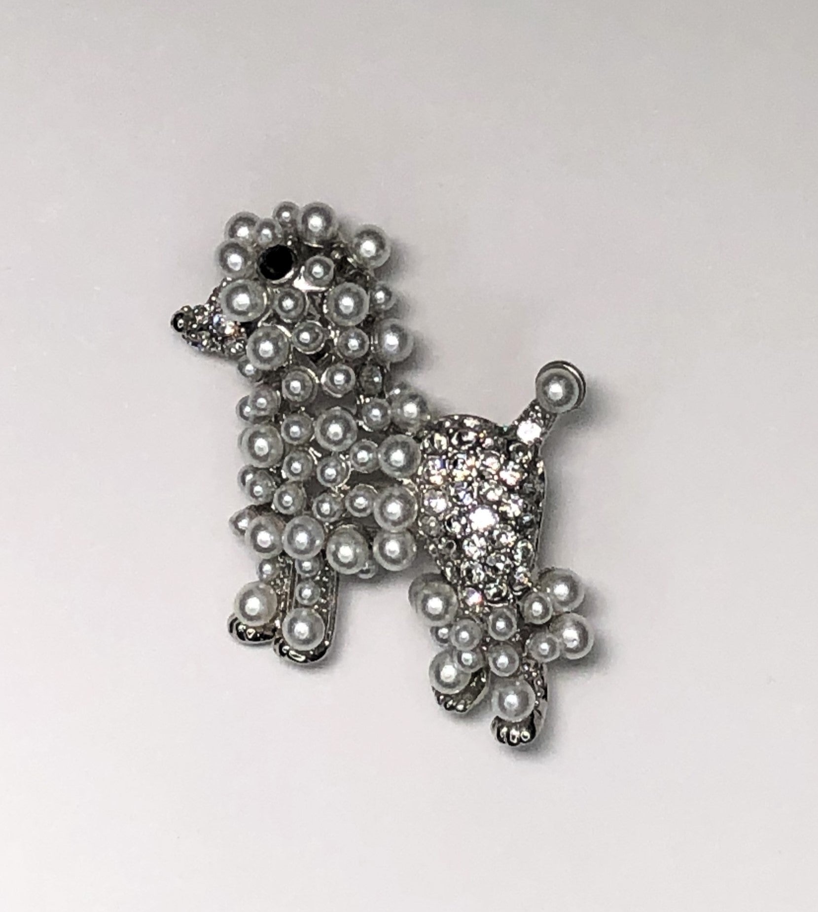 White pearl and silver diamante poodle dog with black crystal eye brooch at erika