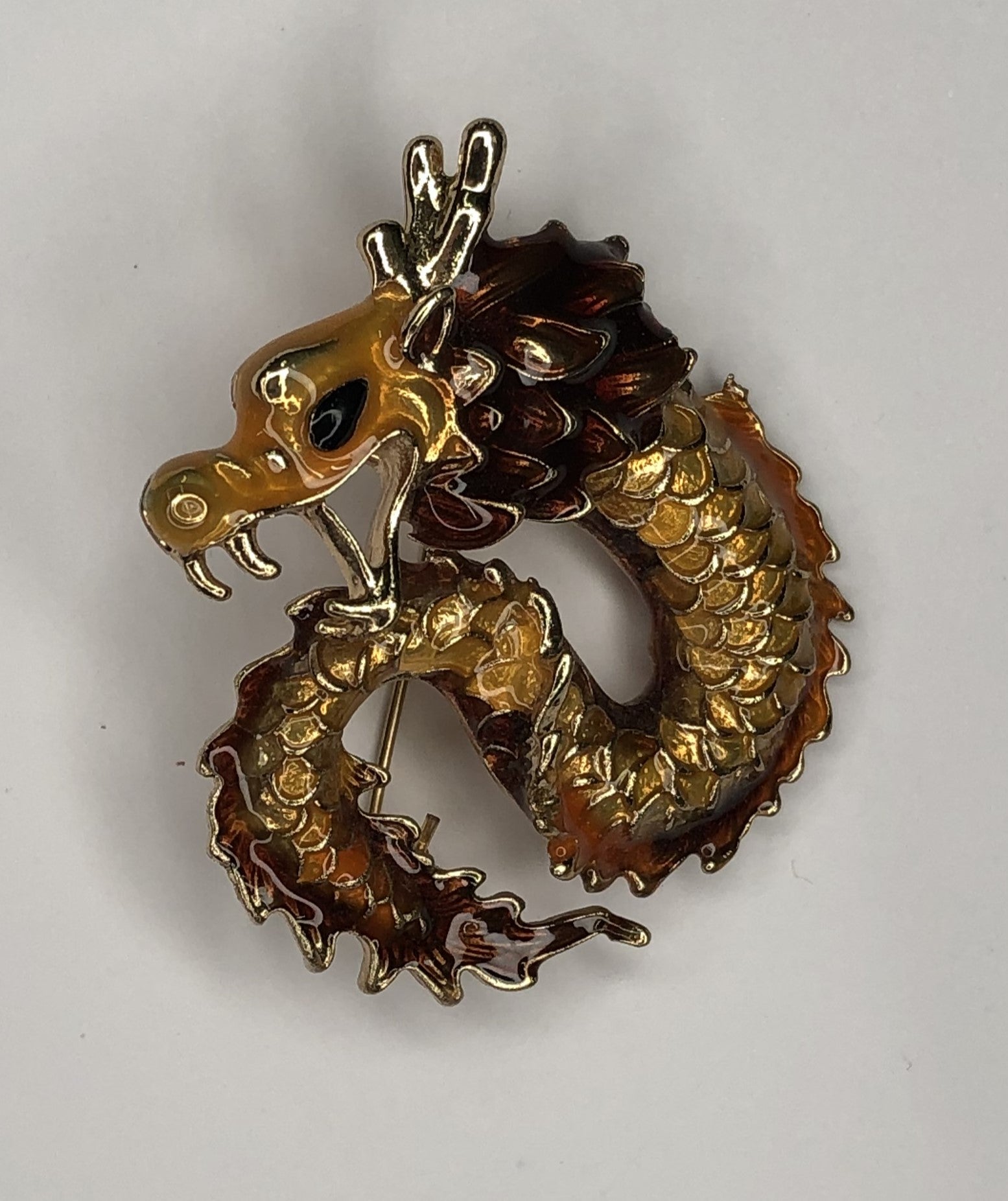 Brown and gold enameled dragon brooch at erika