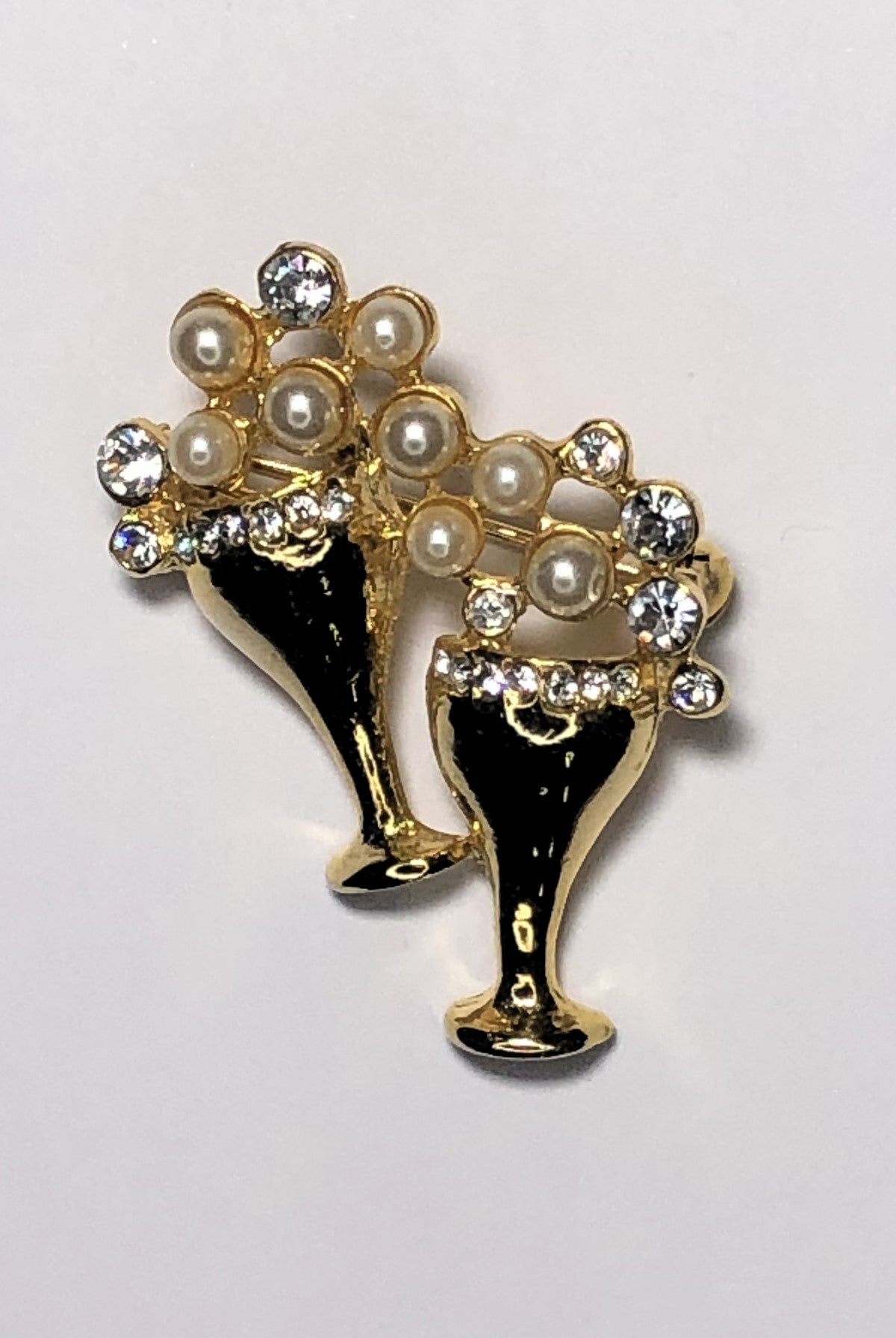 Cheers champagne glasses with pearl and diamantes brooch at erika