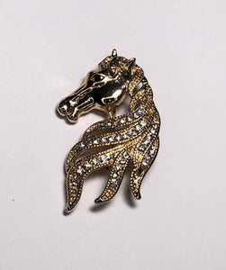 Gold horse showing mane with diamante brooch at erika