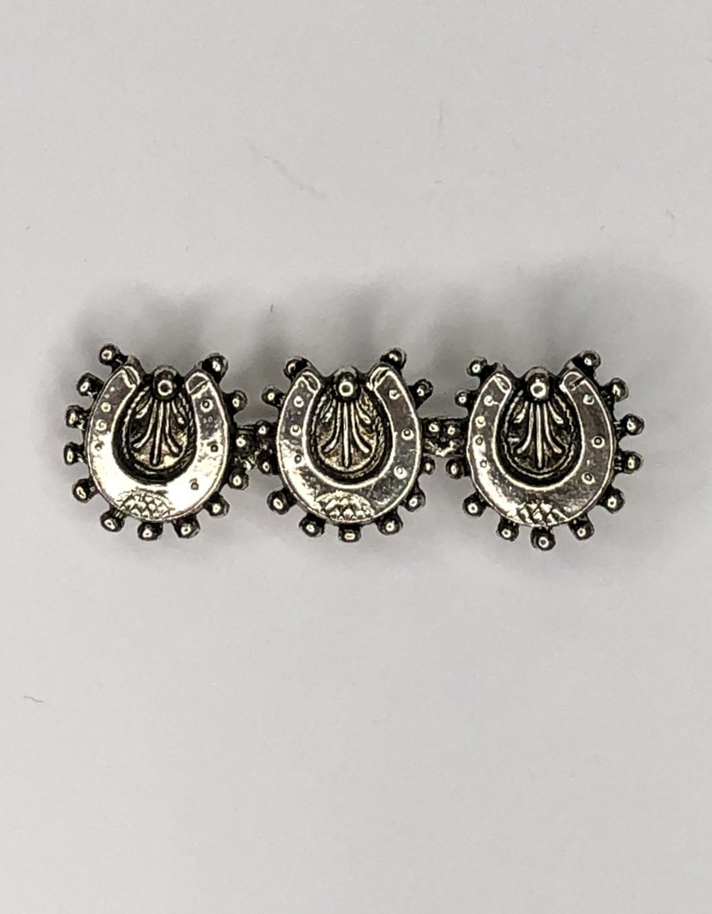 Silver lucky horse shoes brooch at erika