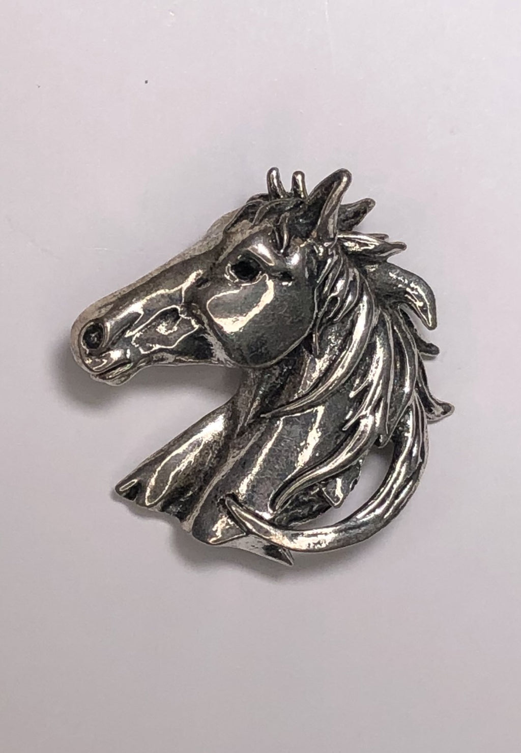 Silver horse head with black diamante eye brooch at erika