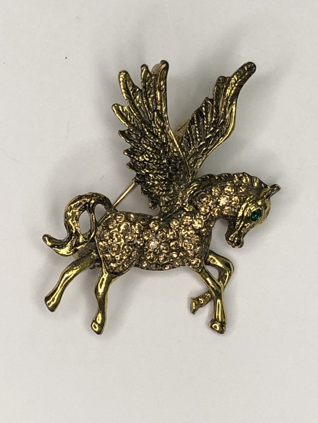 Gold diamante Pegasus with green eye brooch at erka