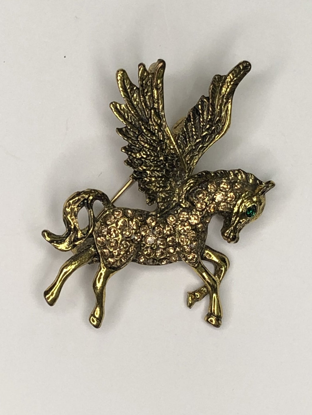 Gold diamante Pegasus with green eye brooch at erka