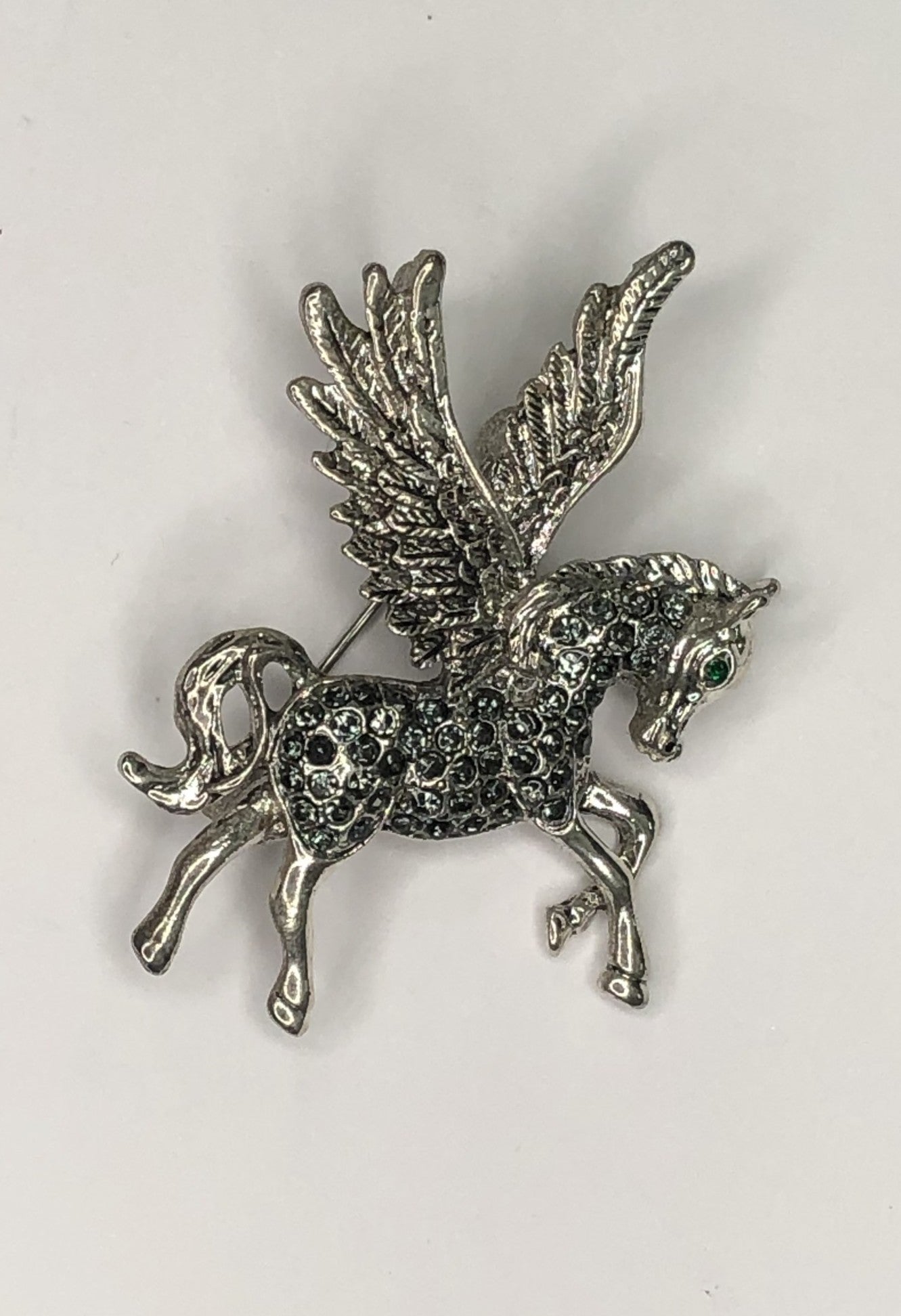Silver diamante Pegasus with green eye brooch at erika