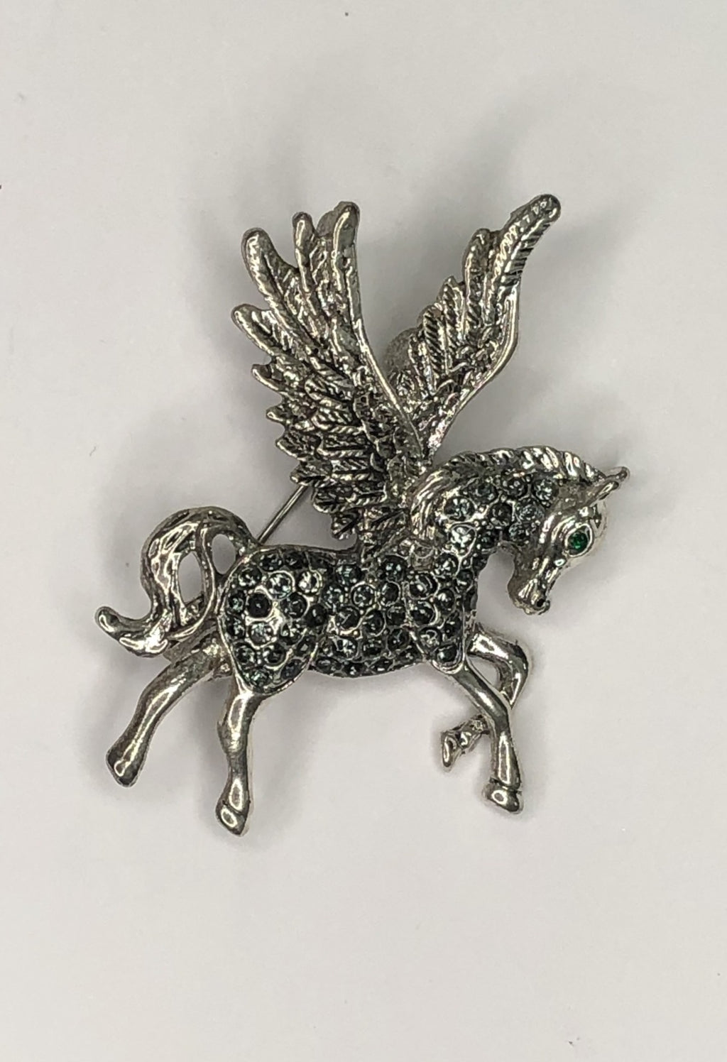 Silver diamante Pegasus with green eye brooch at erika