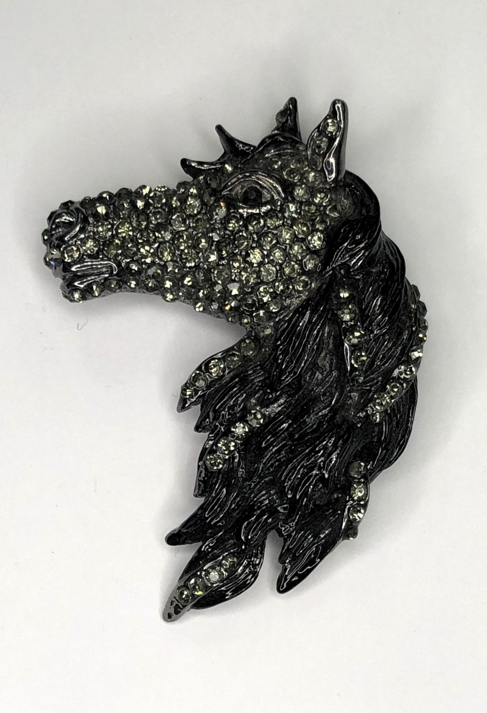 Large black metal diamante encrusted horse head brooch at erika