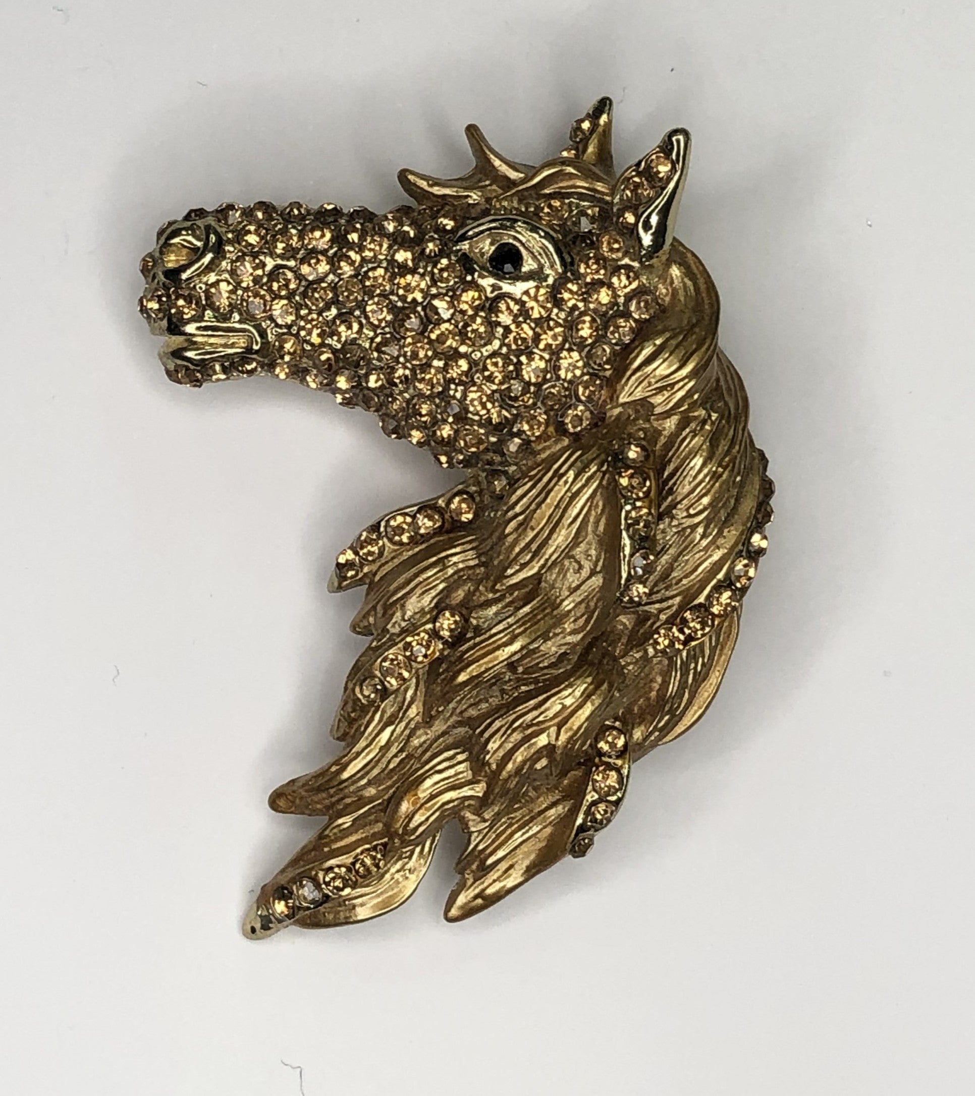 Large gold metal diamante encrusted horse head brooch at erika