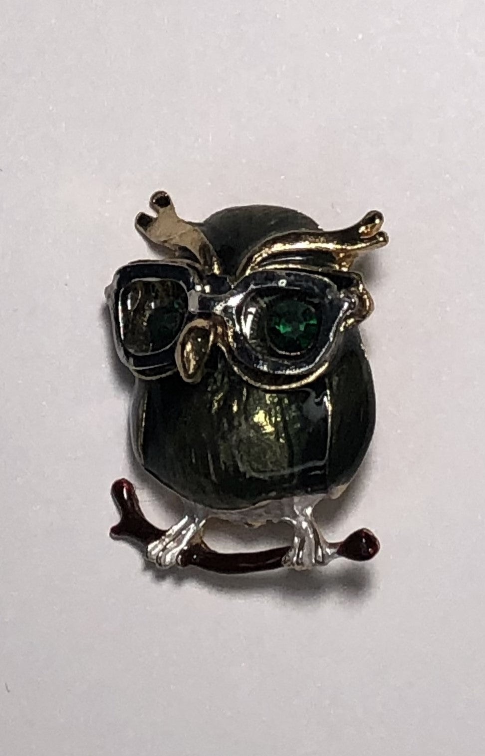 Green owl wearing glasses enameled with emerald eyes brooch at erika