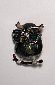 Green owl wearing glasses enameled with emerald eyes brooch at erika