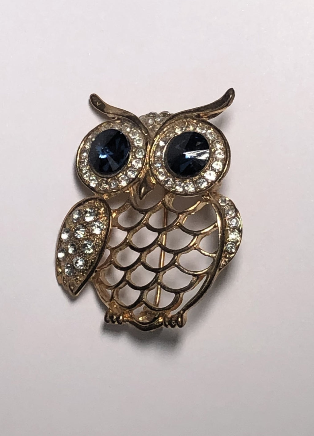 Large gold owl with sapphire eyes brooch at erika