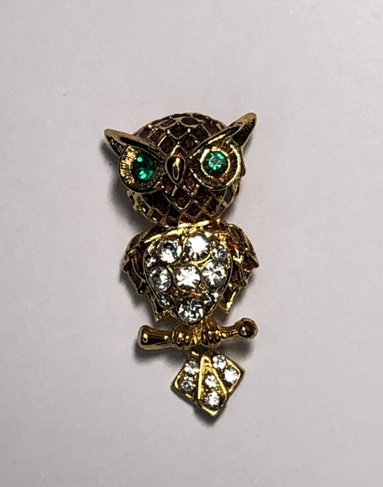 Gold owl with green eyes and movable tail brooch at erika