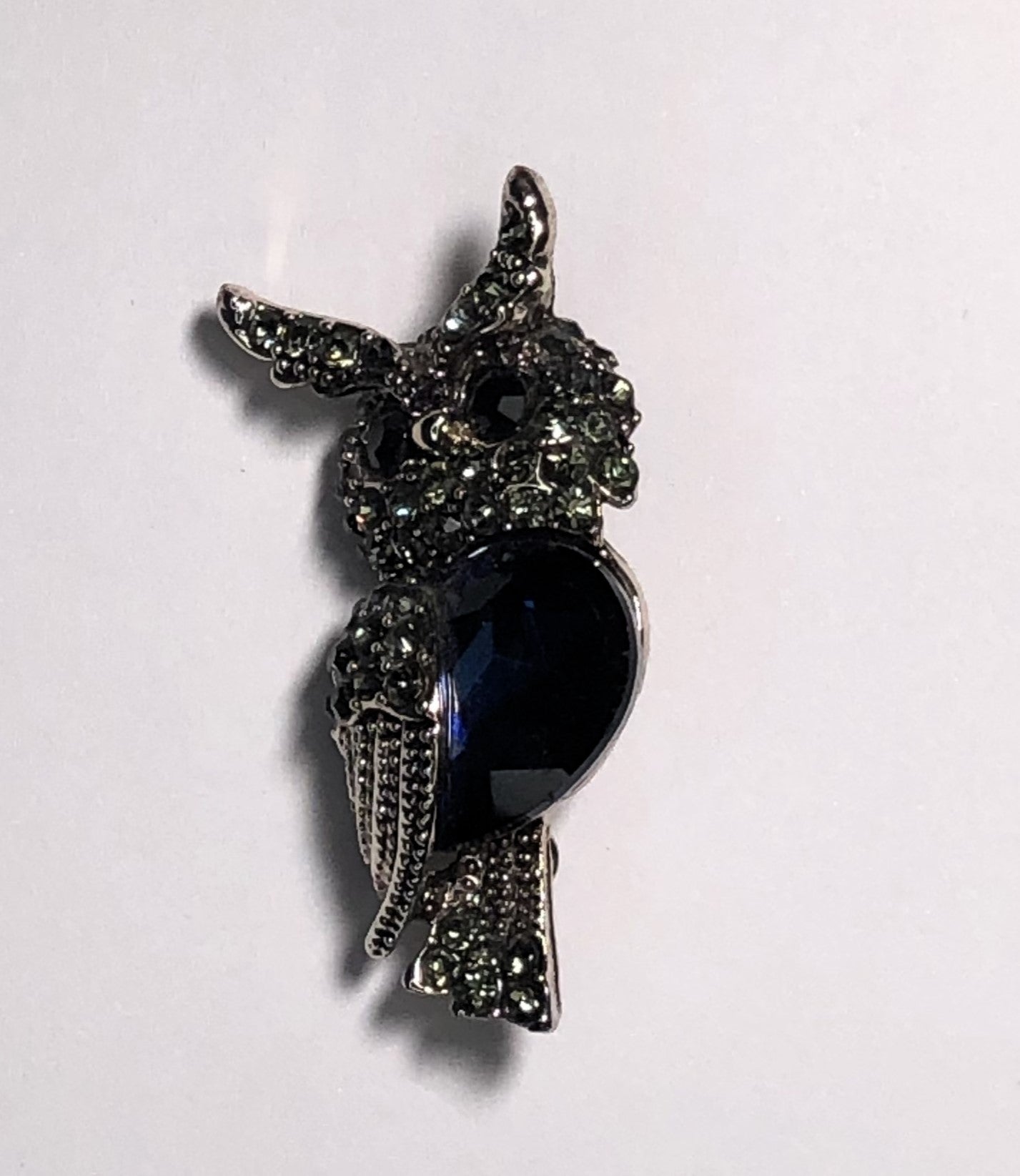 Silver owl with sapphire stone body brooch at erika