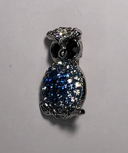 Small silver owl with blue diamante body brooch at erika