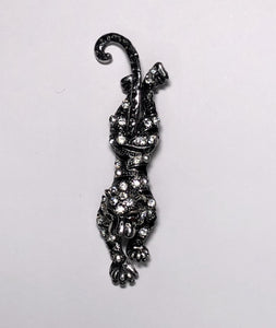 Black and silver pouncing tiger brooch at erika