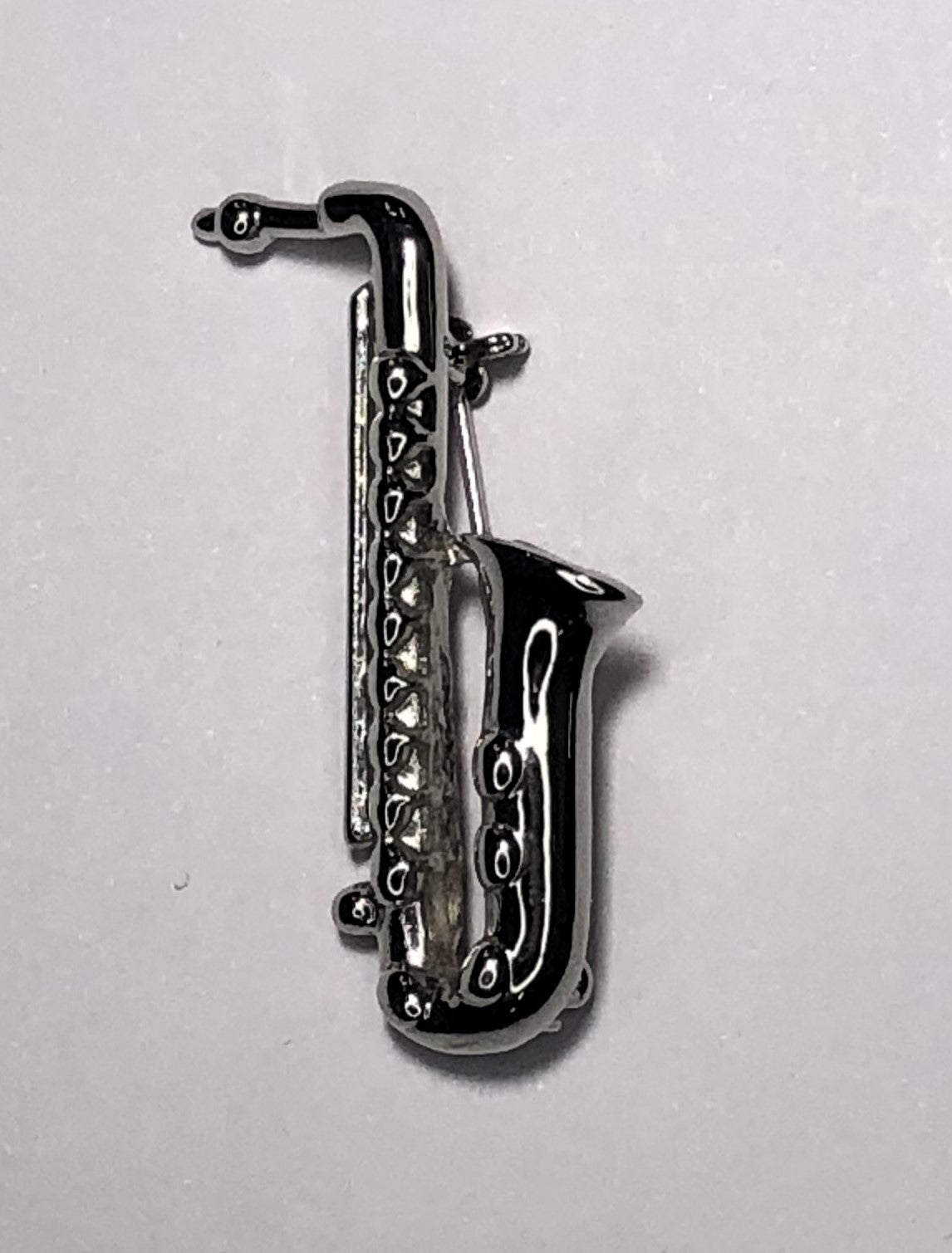 Silver saxophone brooch at erika