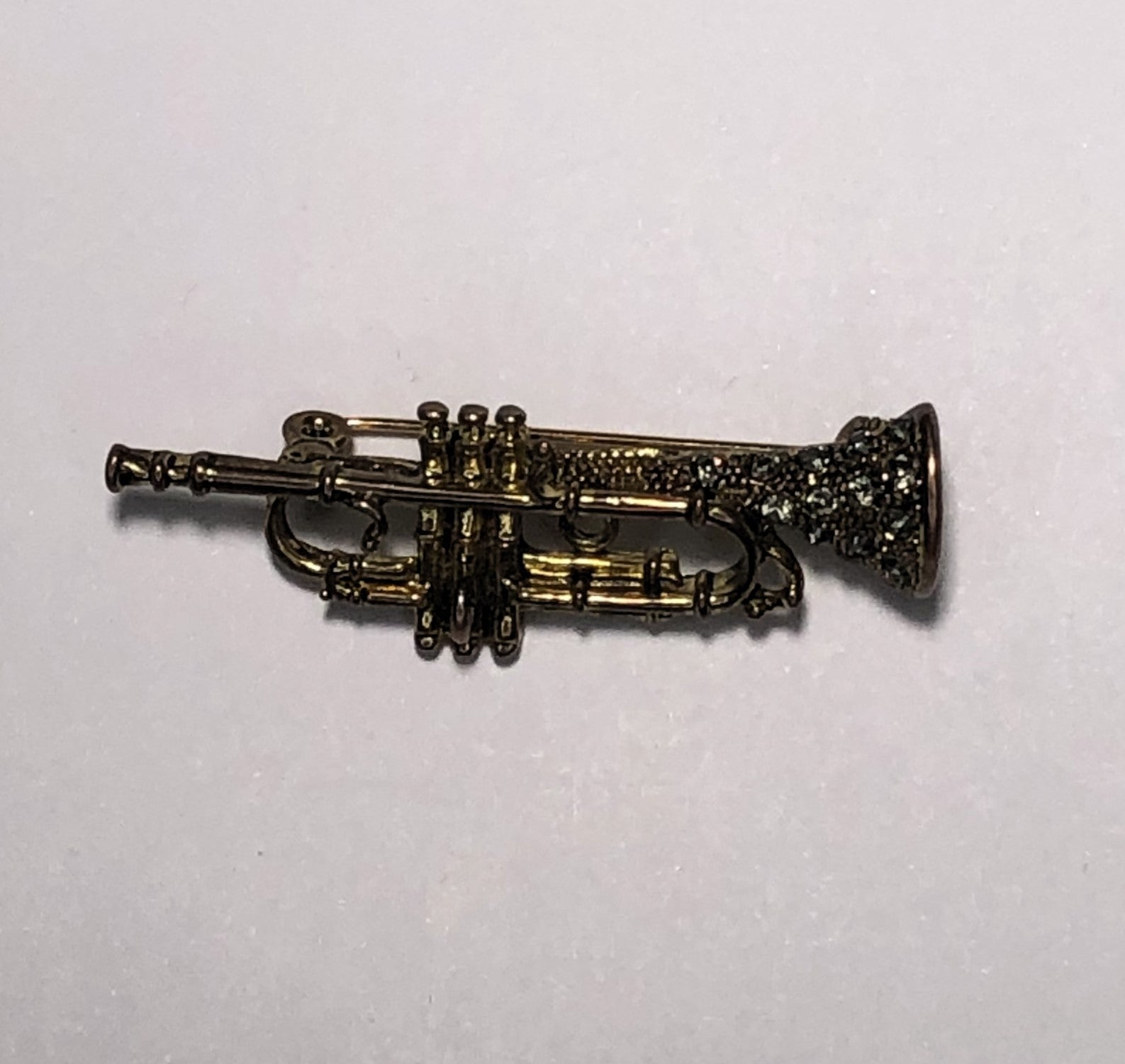 Gold and diamante trumpet brooch at erika