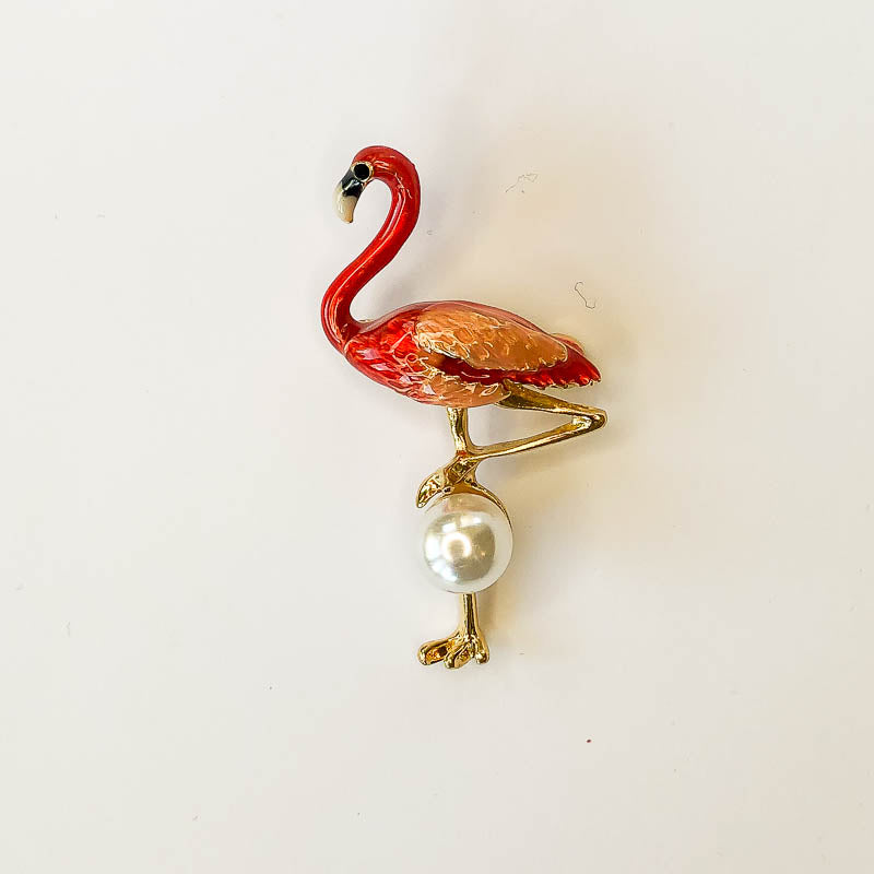 pink flamingo with pearl brooch