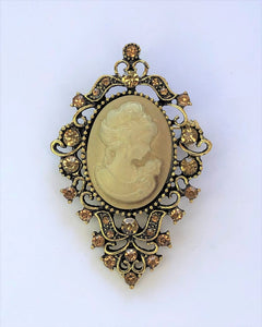 Gold tone cameo style brooch at erika