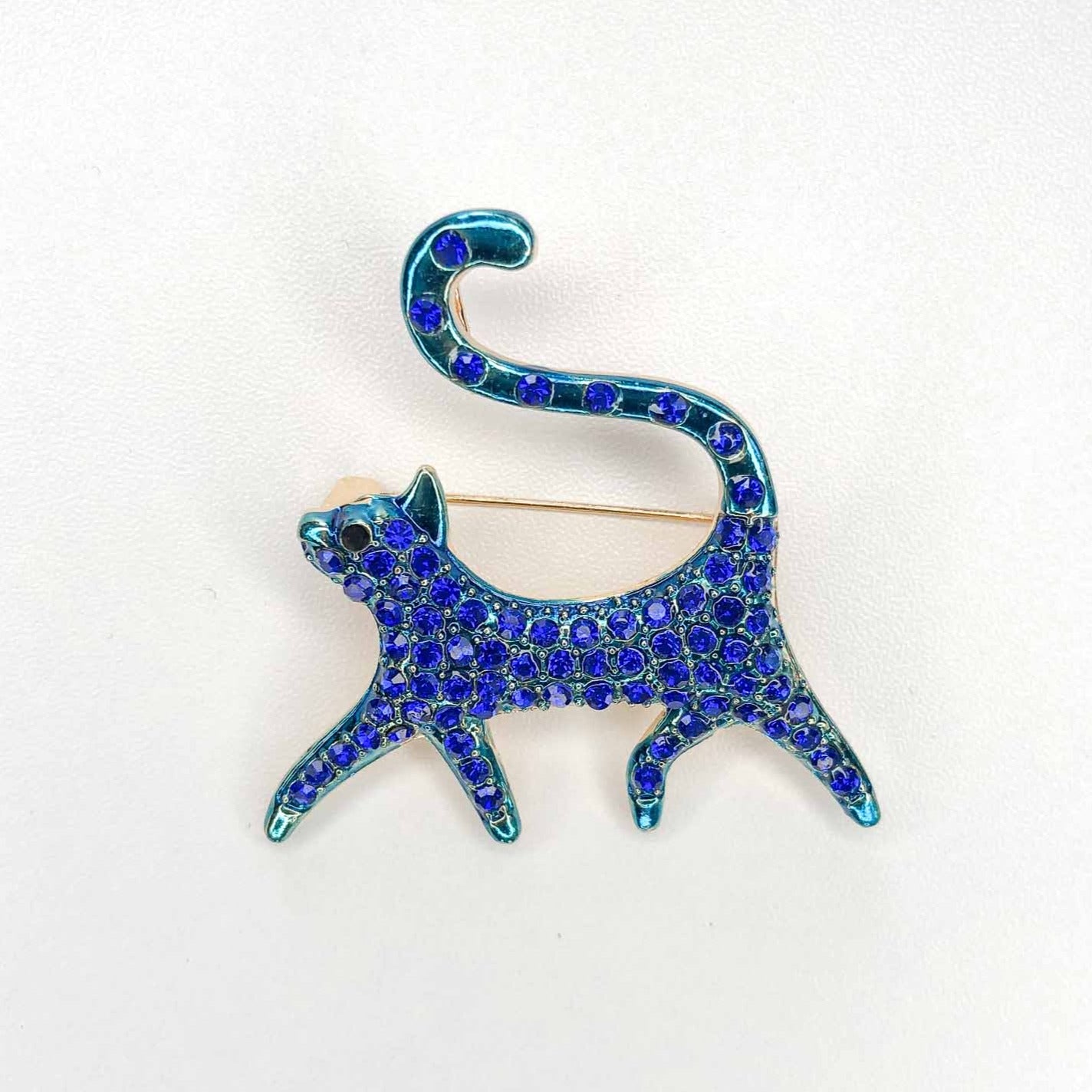 blue and green crystal cat brooch