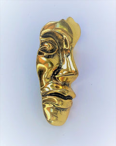 Gold face profile brooch at erika